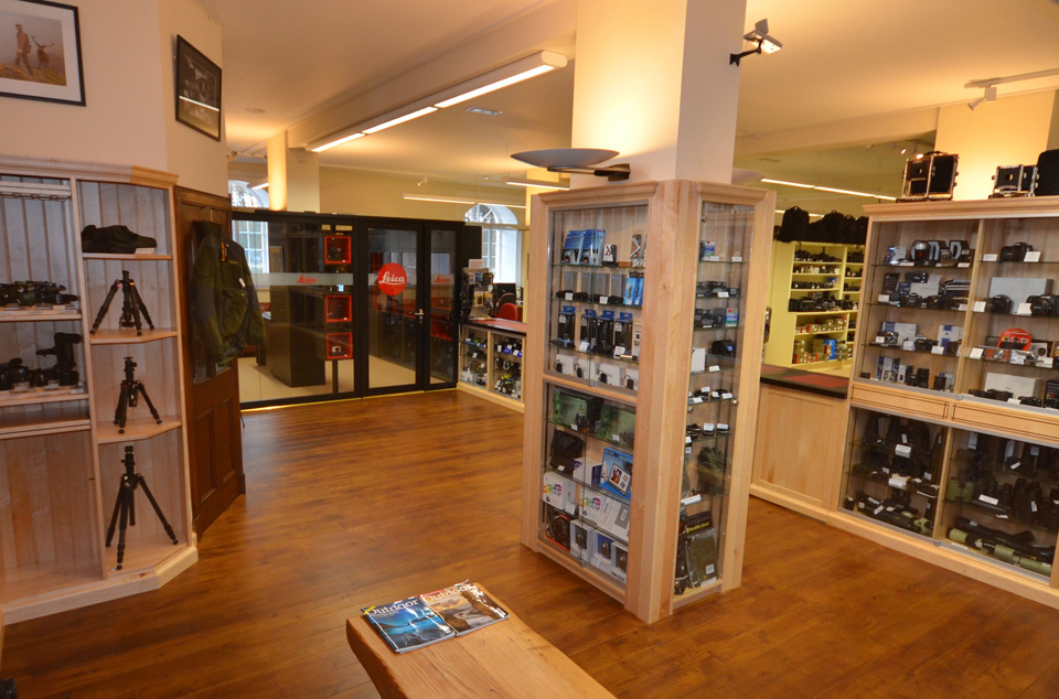 A store featuring a wooden floor and shelves