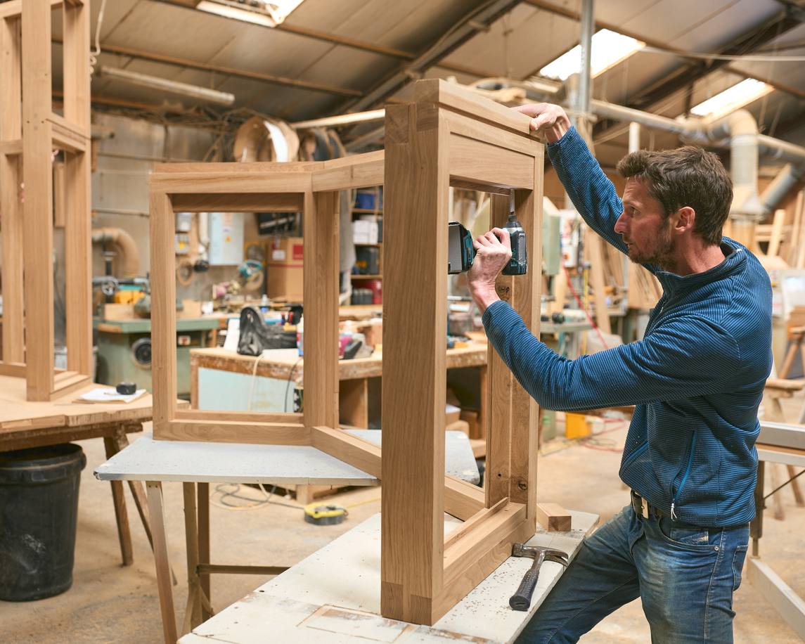 A bespoke fitted wardrobe designed for optimal storage and style.