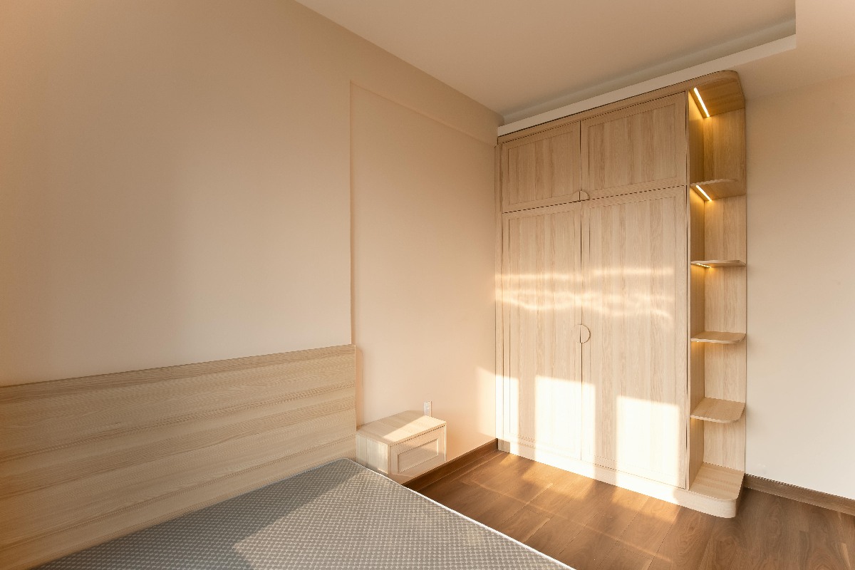 A fitted wardrobe designed to maximise bedroom storage in a modern home.