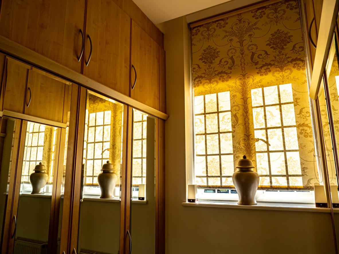 A wardrobe adorned with a vase